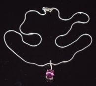 A 9ct white gold pendant set with pink sapphire and white sapphires (1.7g) on silver chain