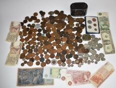 A collection of sundry UK and overseas coinage, some banknotes, vintage money box etc