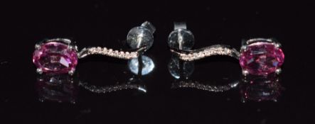 A pair of 9ct white gold earrings set with old cut pink synthetic sapphires and diamonds, 2.5g
