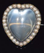 Victorian heart shaped brooch set with a heart shaped moonstone surrounded by seed pearls, 9.1g, 2.8