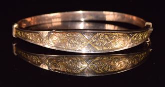 A 9ct rose gold bangle with engraved decoration, Chester 1914, 4.8 x 6cm - 6.2g