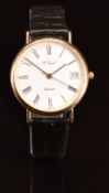 H Samuel 9ct gold gentleman's wristwatch with date aperture, black hands and Roman numerals, white