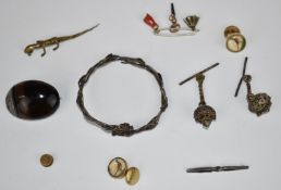 A silver bangle, agate brooch, coral charm etc