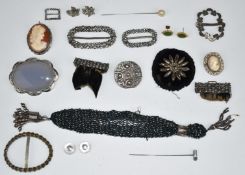 A silver brooch set with a cameo, silver brooch set with agate, Robert Allison Celtic silver brooch,