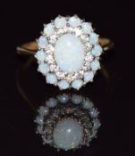 A 9ct gold ring set with opals and cubic zirconia, 3.8g, size Q