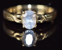A 9ct gold ring set with an oval cut white sapphire, 3g, size M/N