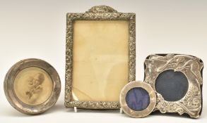 Four various hallmarked silver photograph frames, largest to suit 6 x 4 inch photo, one with birds