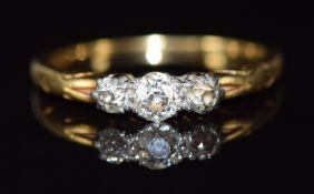 An 18ct gold ring set with three old cut diamonds in a platinum setting, 3.3g, size Q