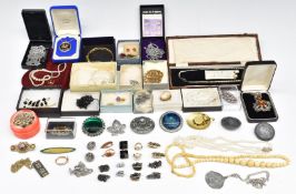 A collection of costume including brooches, faux pearls, pewter, crystal beads, Miracle brooch, etc