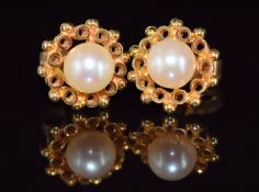 A pair of 18ct gold earrings set with a pearl to each, 2g