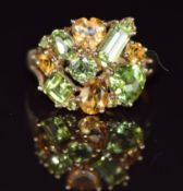 A 9ct gold ring set with citrines and tourmalines, 3.4g, size N
