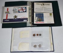 Two coin collection albums containing coins and a selection of coin/stamp covers