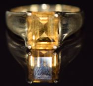 A 9ct gold ring set with an emerald cut citrine, 2.6g, size N