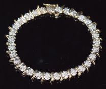 A 9ct gold tennis bracelet set with diamonds, 6.8g, 16cm long