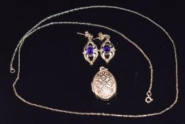 A 9ct gold locket and a pair of 9ct gold earrings set with an amethyst to each, 4.6g