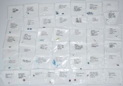 Approximately one hundred and forty three loose gemstones comprising sixty four loose white and blue