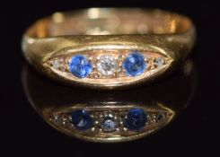 An 18ct gold ring set with diamonds and sapphires, Birmingham 1915, 2.2g, size M
