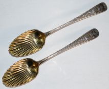 Pair of Georgian hallmarked silver berry spoons with gilt finish and shell shaped bowls, London