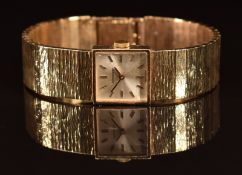 Longines 9ct gold ladies wristwatch with gold hands and hour markers, silver dial and signed calibre