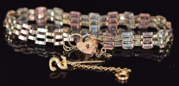 A 9ct gold tri-coloured gate bracelet and a 9ct gold stick pin, 6.3g
