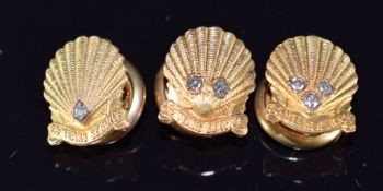Three 9ct gold buttons for long service with Shell, all set with diamonds, 10.2g