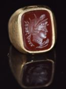 A 9ct gold ring set with an agate intaglio, 7.9g, size H