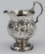 Georgian hallmarked silver cream jug with embossed decoration, London 1764, maker's mark rubbed,