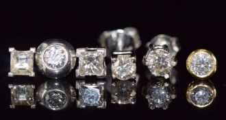 An 18ct gold earring set with a princess cut diamond of approximately 0.25ct, an 18ct gold earring