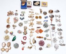 A collection of brooches including Sphinx, cameo, Christina Dior, vintage paste, Siam silver,