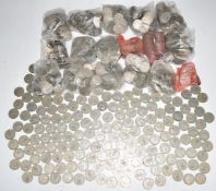 Approximately 10.62kg of UK post 1947 two shilling pieces