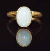An 18ct gold ring set with an opal cabochon cabochon, 2.7g, size K