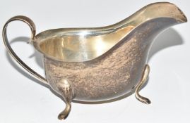 Walker & Hall Elizabeth II hallmarked silver sauce boat raised on three feet, Birmingham 1960,