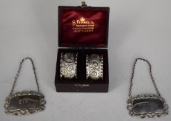 Pair of modern hallmarked silver bottle tickets or labels for gin and whisky together with a cased
