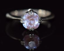 A silver ring set with a saphiret, size E