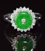 An 18k white gold ring set with jade and diamonds, 2.9g, size J