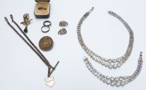 An 18ct gold ring set with diamonds, Victorian silver double Albert, coin brooch, two silver