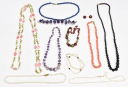 Necklaces including amethyst, pearl, sodalite and quartz, peridot and pearl examples and pearl