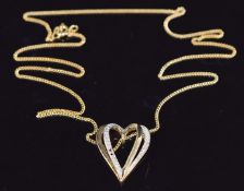 A 9ct gold heart pendant set with diamonds on 9ct gold chain, 3.7g