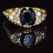 A 9ct gold ring set with a sapphire and diamonds, 4.6g, size P