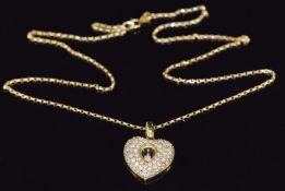 An 18ct gold heart pendant set with round cut diamonds with moving diamond enclosed to the centre,