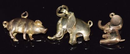 Three 9ct gold charms / pendants in the form of elephants and a pig, 9.3g, largest 1.7cm