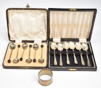 Two cased sets of six hallmarked silver coffee or teaspoons and a hallmarked silver napkin ring,