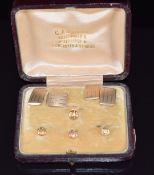 Four 9ct gold studs with foliate decoration and a pair of 9ct gold cufflinks with engine turned