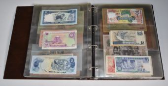 Asia banknote collection in an album, includes Cambodia, Vietnam, Laos French rule example,