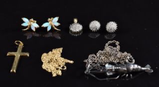 A 9ct gold pendant set with diamonds with matching earrings, a pair of 9ct gold earrings set with