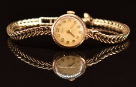 Tudor Royal 9ct gold ladies wristwatch with gold hands and Arabic numerals, champagne dial and