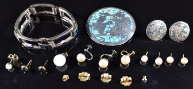 A collection of jewellery including silver bracelet set with enamel, Mexican brooch and earrings,