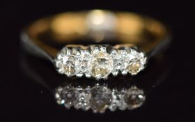 An 18ct gold ring set with three diamonds in a platinum setting, 2.3g, size L