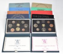 Royal Mint 1984 and 1986 proof brilliant uncirculated coins sets in cases with certificates,