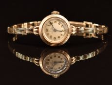 Record 9ct gold ladies wristwatch with blued hands, gold Arabic numerals and silver dial, on 9ct